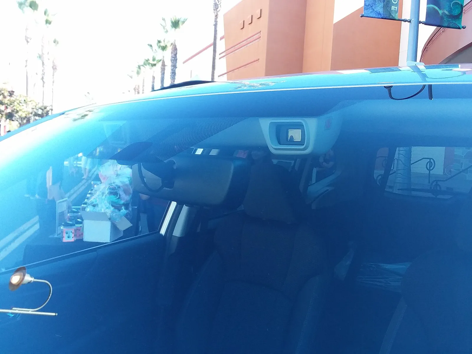 Subaru Forester EyeSight stereo camera unit mounted behind the windscreen beside the rear-view mirror