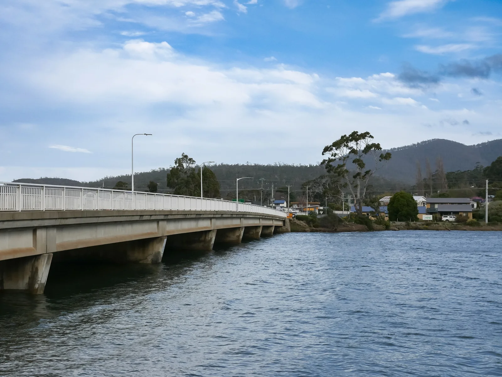Tasman Highway bridge crossing the Prosser River at Orford on Tasmania's east coast under a blue sky