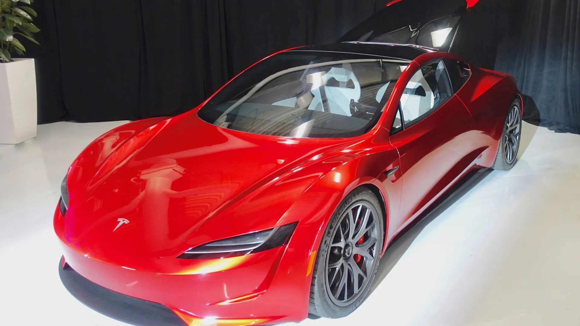 2017 Tesla Roadster prototype, the design replaced by the 2026 Roadster Red 2017 Tesla Roadster prototype, front three-quarter view, the earlier design that the 2026 car replaces