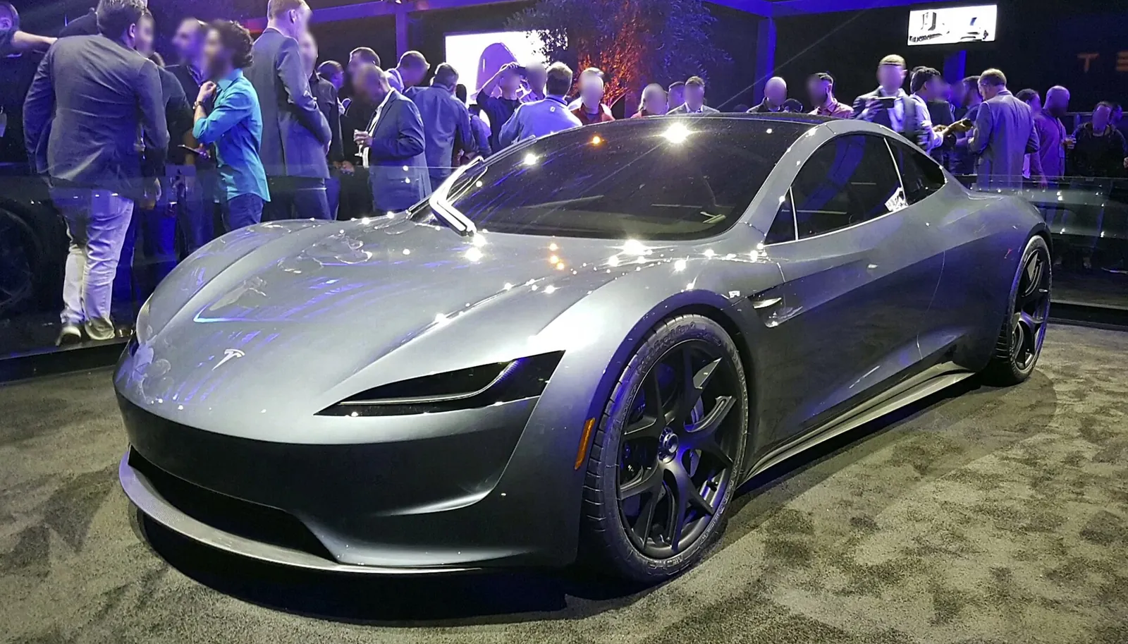Silver Tesla Roadster prototype on display at its November 2017 reveal, with a crowd behind