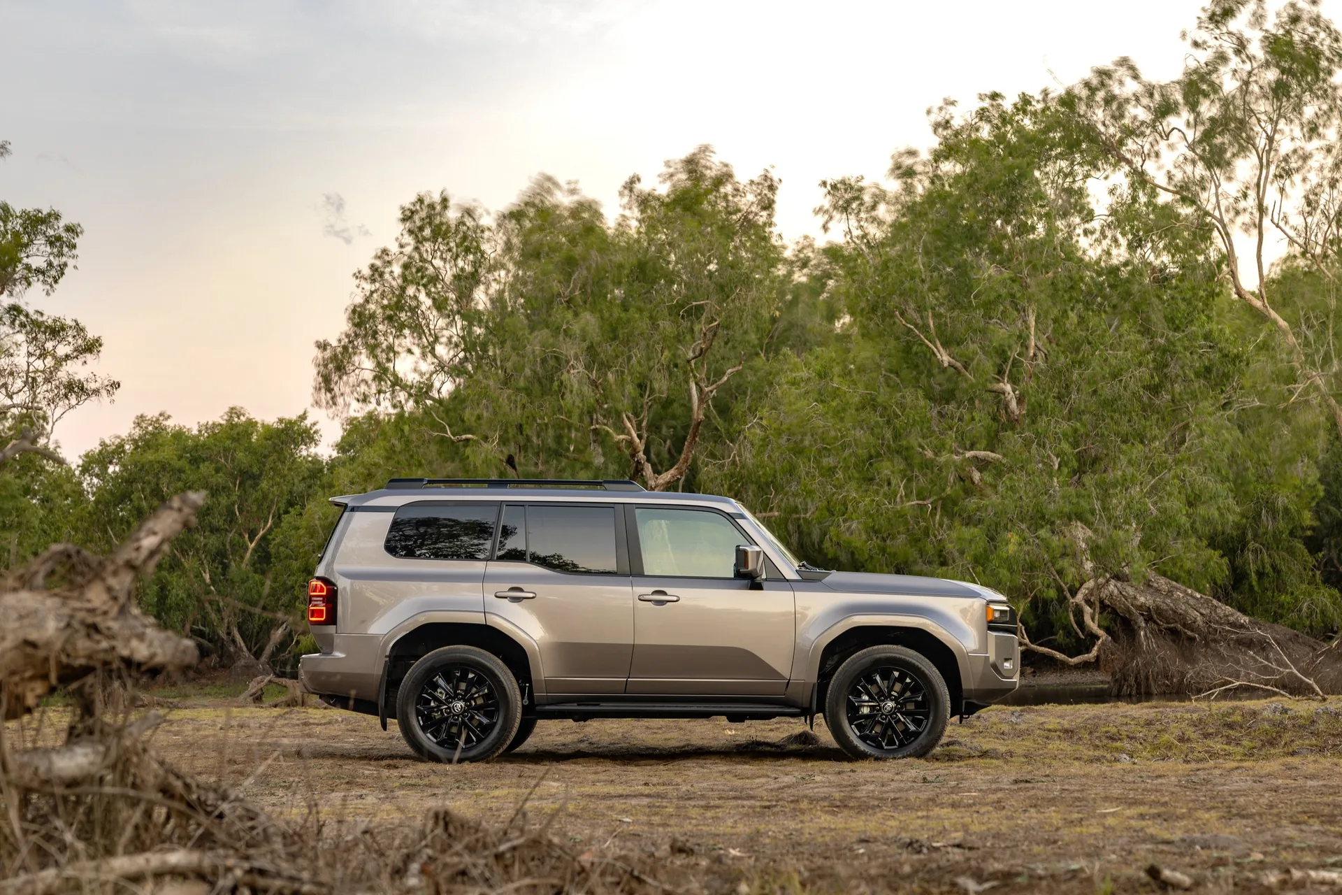 Bronze Toyota LandCruiser Prado 250 Kakadu in side profile parked in Australian bushland