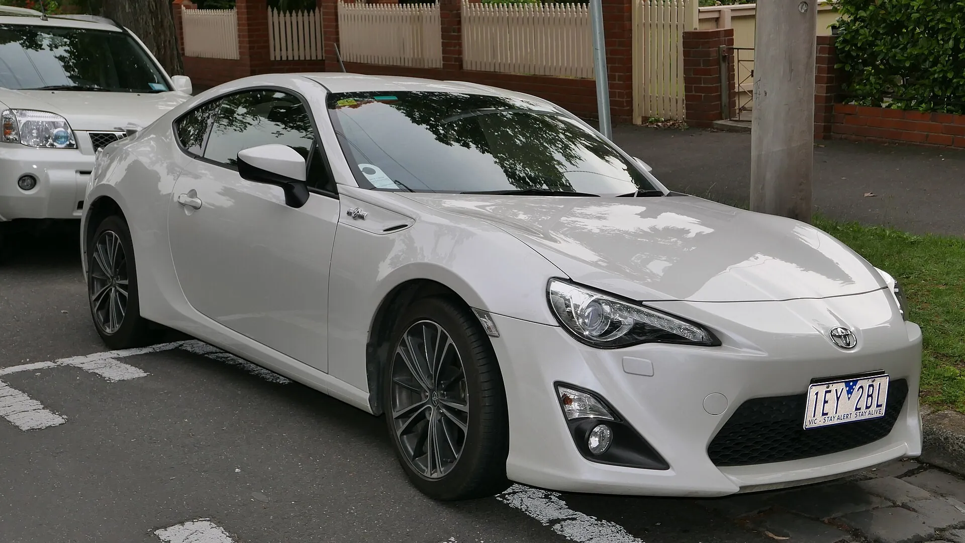 2013 Toyota 86 GTS White 2013 Toyota 86 GTS coupe parked kerbside in Flemington, Victoria, front three-quarter view